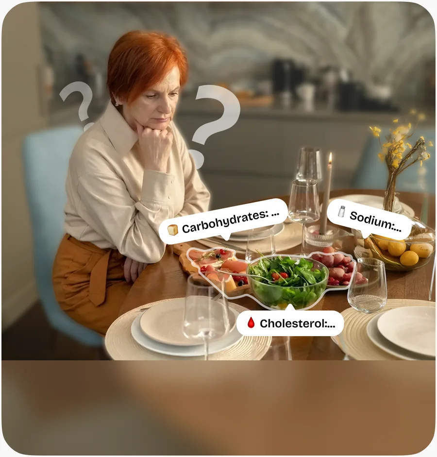 A woman at a dinner table, unsure of the carbohydrates, sodium and cholesterol in front of her